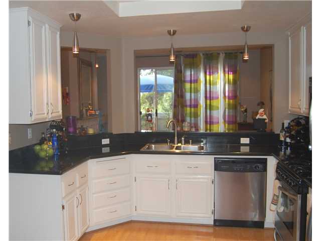 Main Photo: RANCHO PENASQUITOS Townhouse for sale : 4 bedrooms : 9384 Babauta Road #123 in San Diego