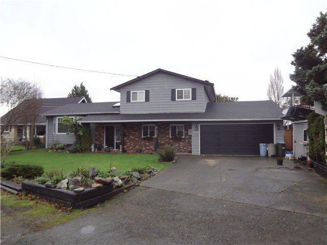Exterior Front: Located a few doors from a park this lovely 3 level split comes with a new roof and vinyl double paned windows.