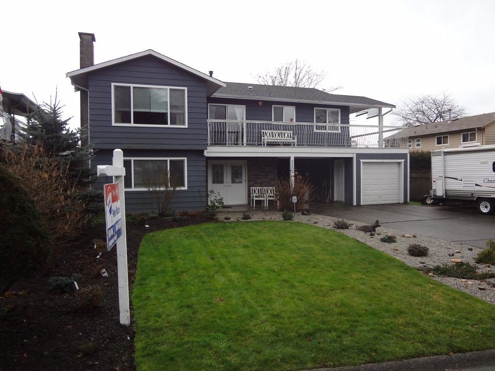 Exterior Front: New roof, new vinyl windows, easy care aluminum siding on a large south exposed lot.