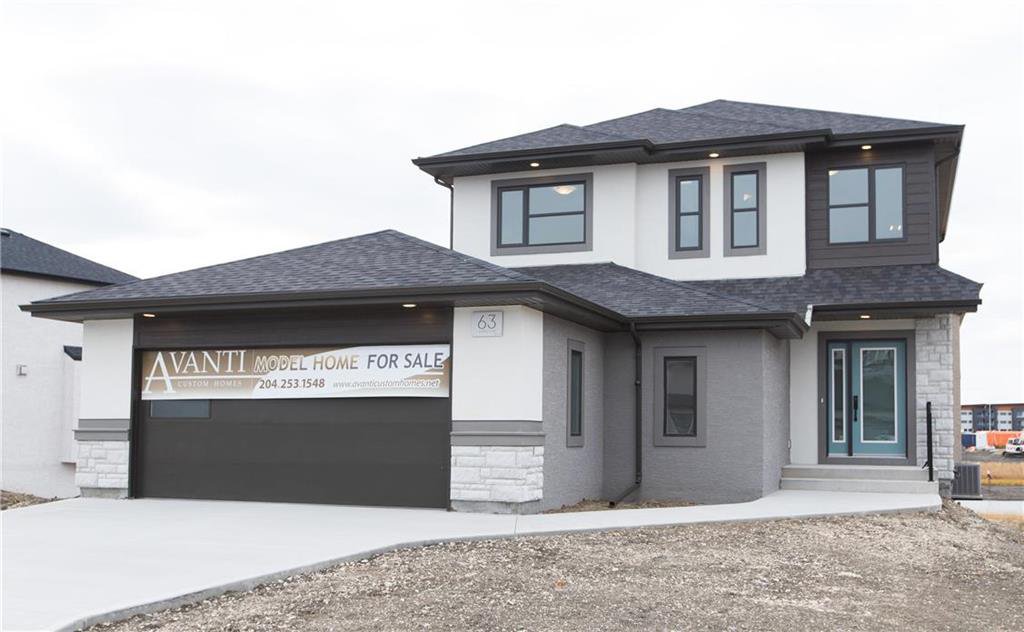 GORGEOUS CURB APPEAL - LARGE DRIVEWAY AND GARAGE WITH ADDED WORKSHOP!