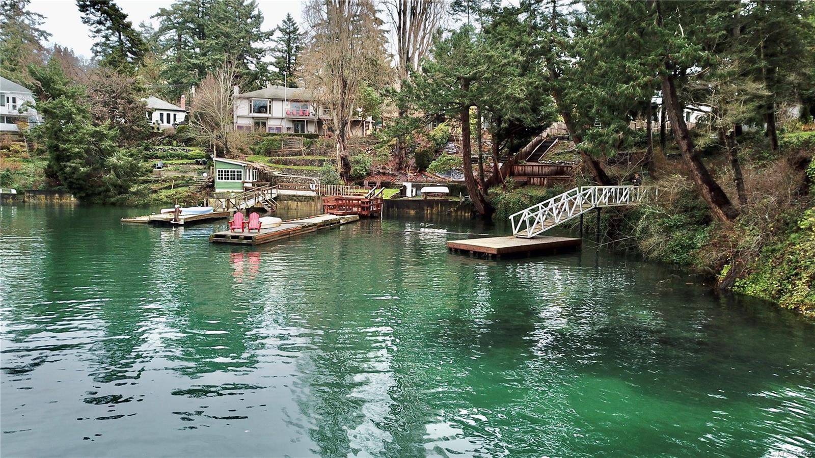 The metal ramp leads from your own dock to your very private building lot. Road access from Stewart Ave